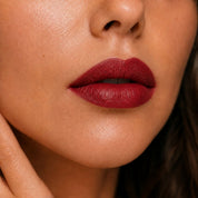 Le Rouge Pourpre Hendiya lipstick applied to the lips, deep purple organic lipstick